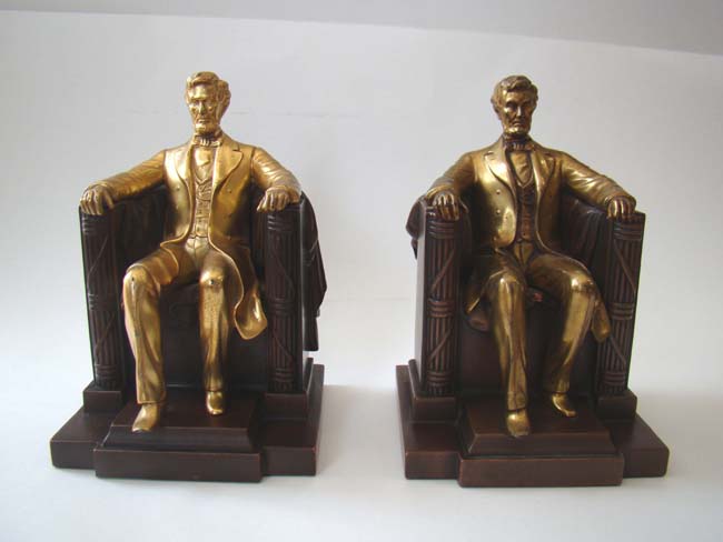 A matched pair of "Lincoln in the chair" bookends by Jennings Brothers circa 1935